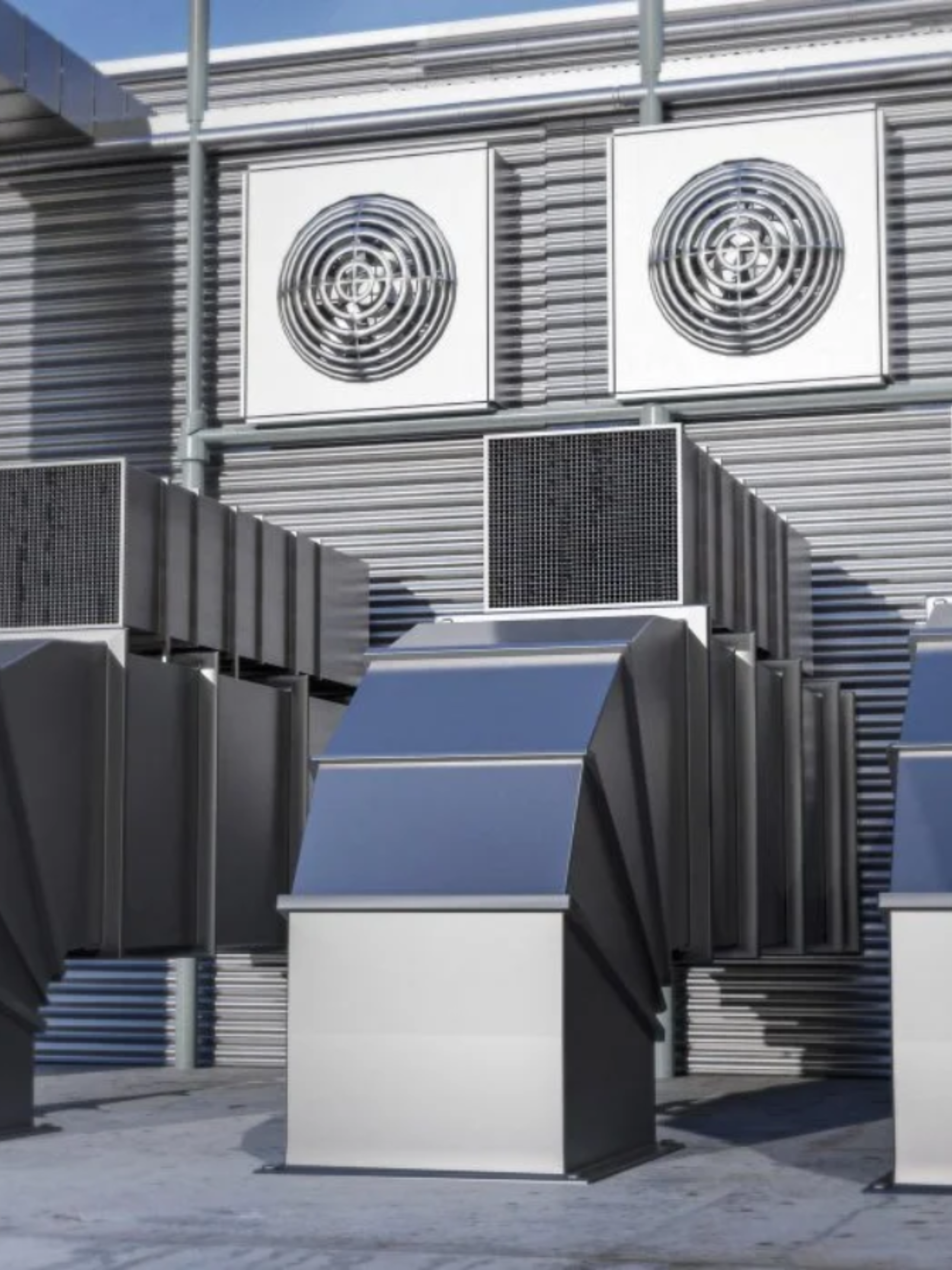 Technician working on rooftop HVAC unit